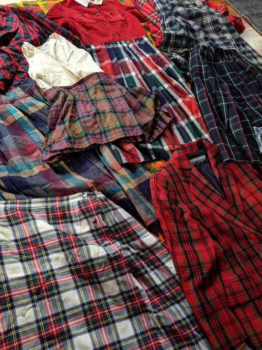 pile of various plaid print vintage clothing